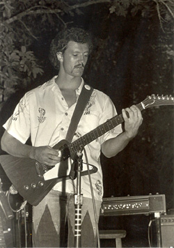 Perforning at an On Stage perfornamce circa 80's looking like Bruce Springsteen